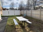 Outdoor picnic table - fenced in back yard